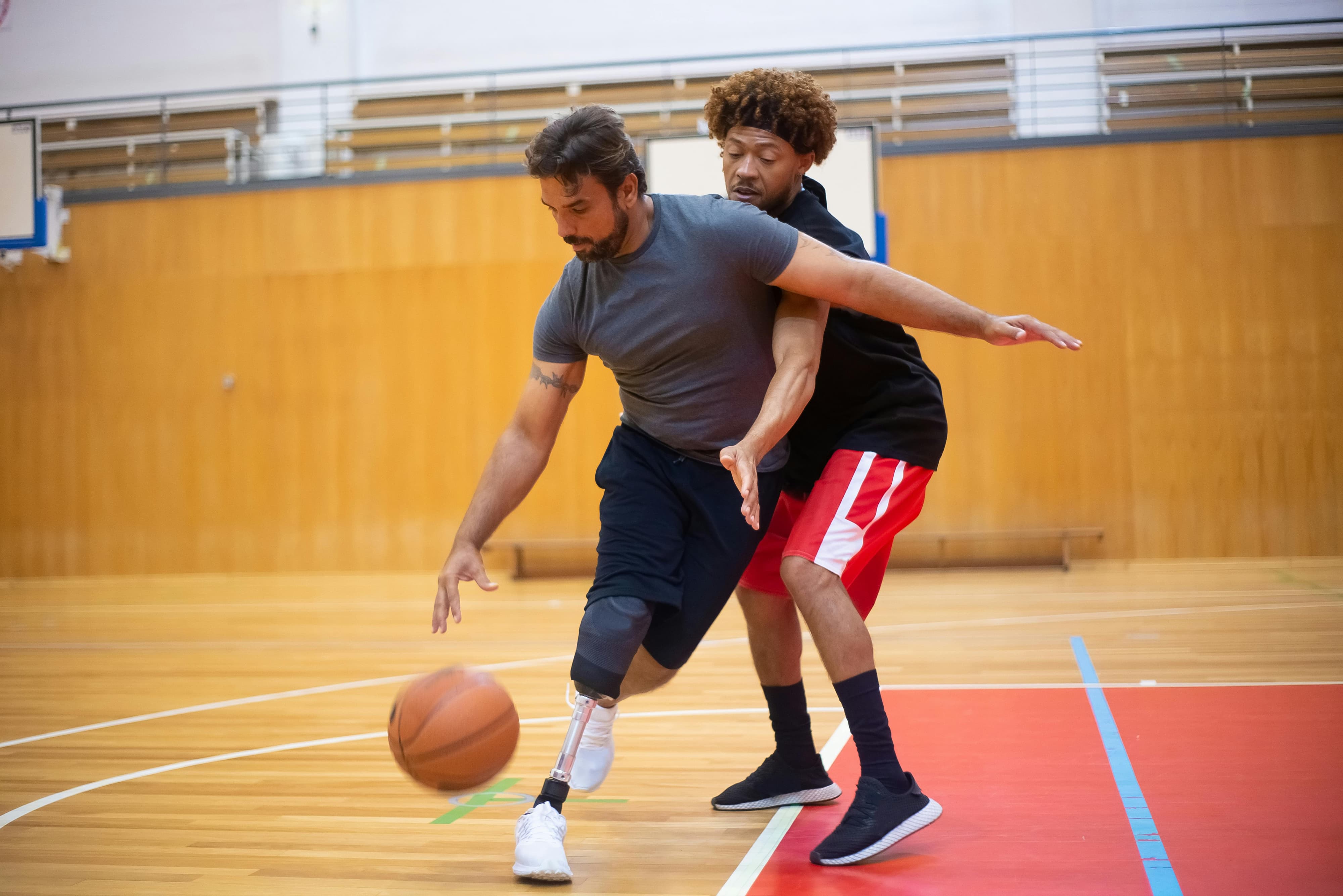 Two men playing basketball
