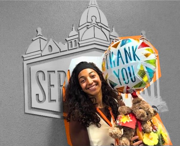 Woman in front of orange wall