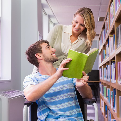 Man in Wheelchair Reading a Book