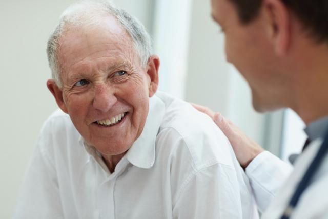 doctor talking to old man